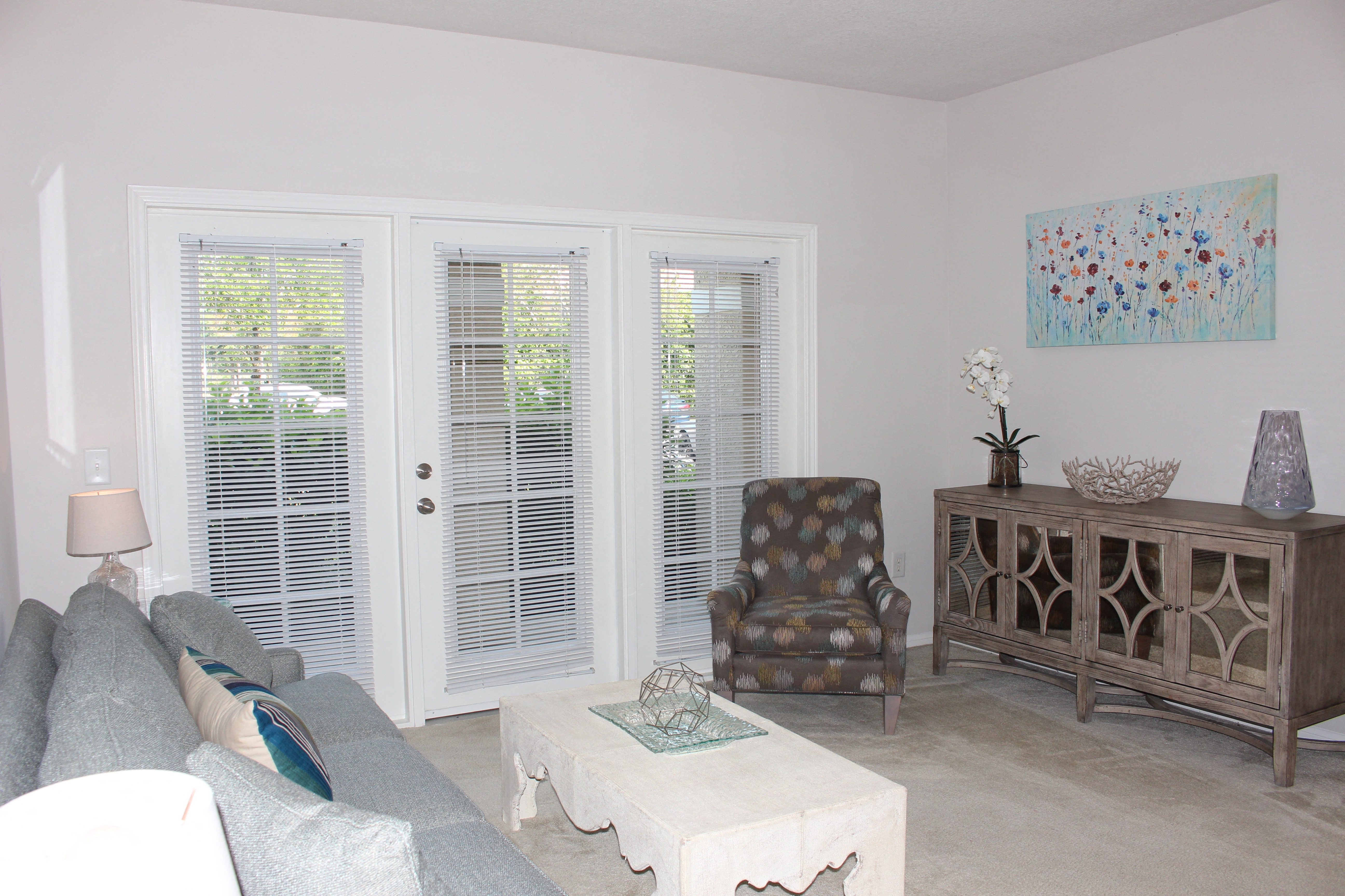 a living room with a couch and a chair